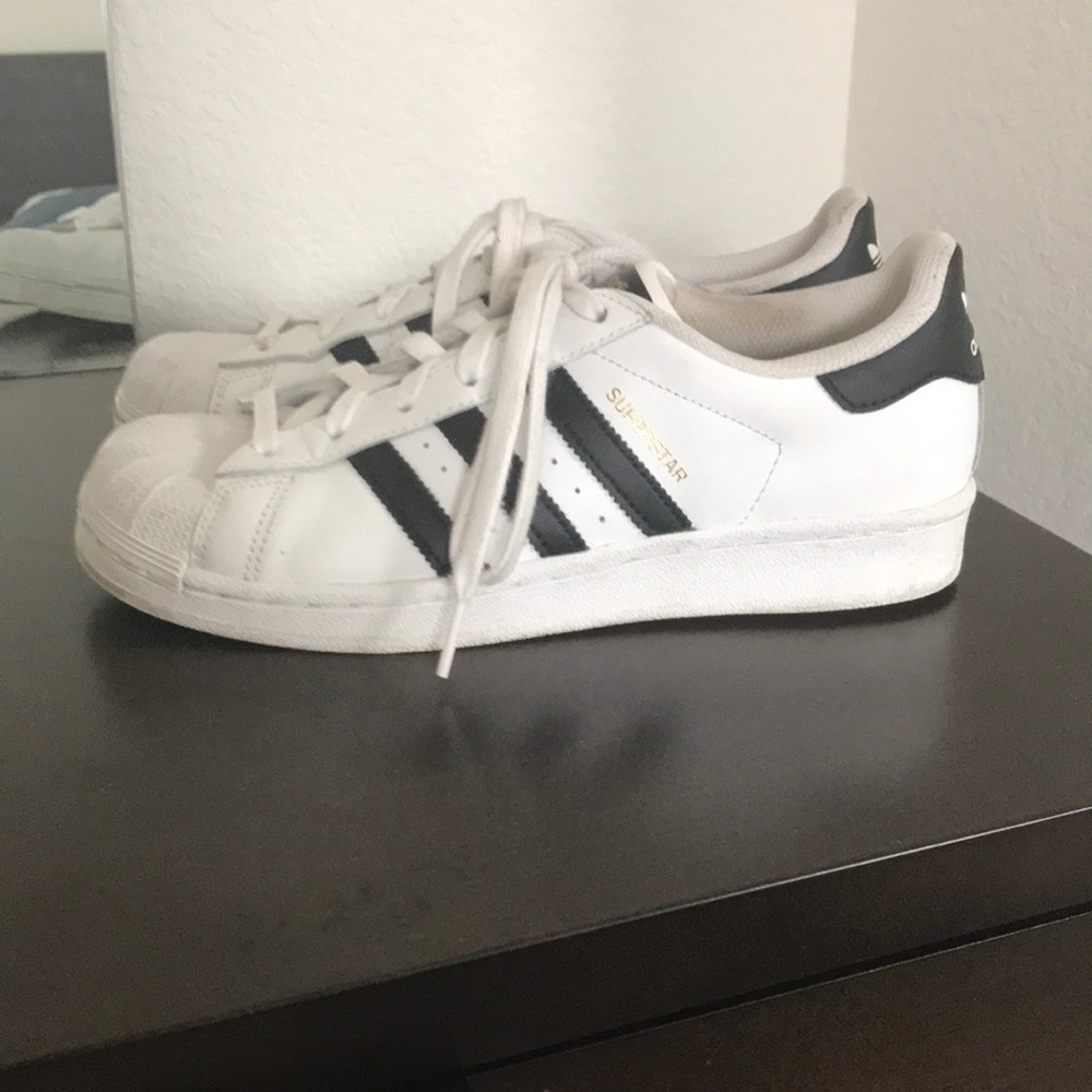 Adidas superstar shell toe sneakers.
